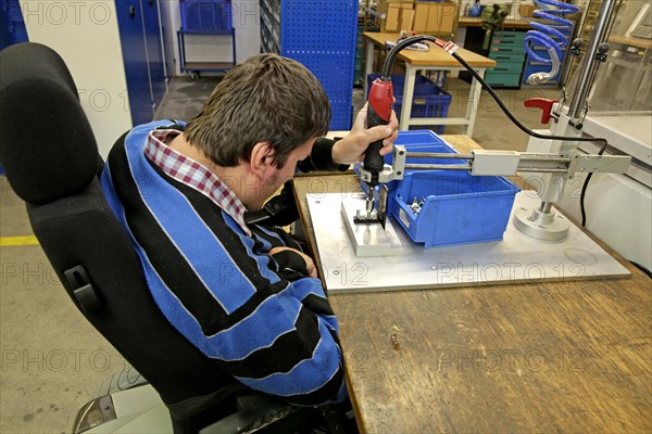 Mentally and physically disabled man at work