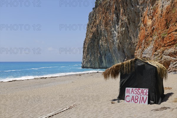 Hut with sign 'Massage Cabin' on the beach of Gazipasa