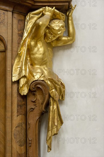 Atlas figure at the confessional