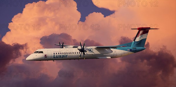 Luxair De Havilland Canada DHC-8-402Q Dash 8 in flight during a thunderstorm