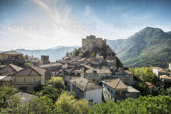 Medieval village with a castle in the mountains