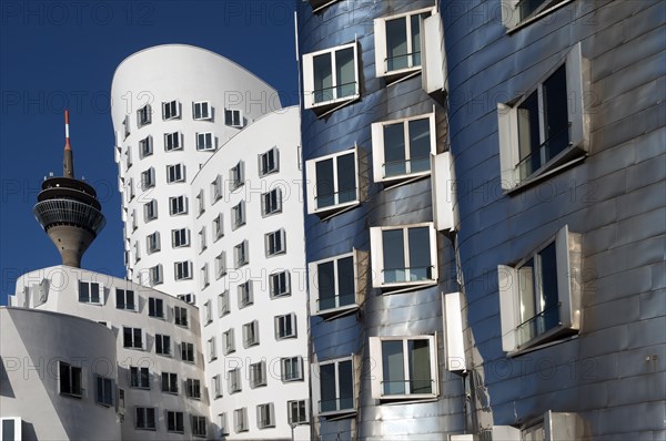 The Rheinturm tower and the Gehry buildings or Neuer Zollhof at Medienhafen