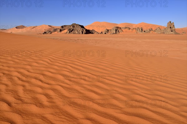 Sand dunes and rocks at Tin Merzouga