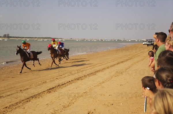 Horse race at the beach of Sanlucar de Barrameda at the Guadalquivir river mouth