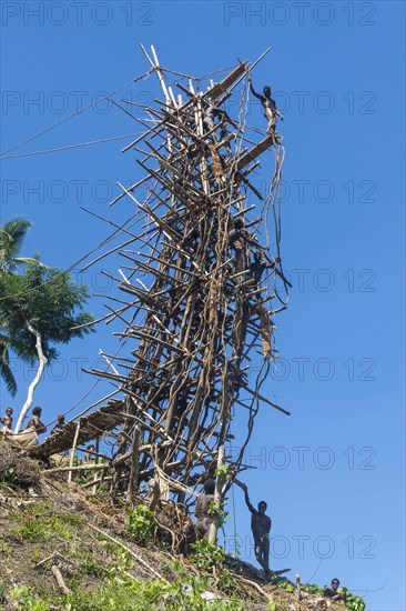 Man jumping from a bamboo tower