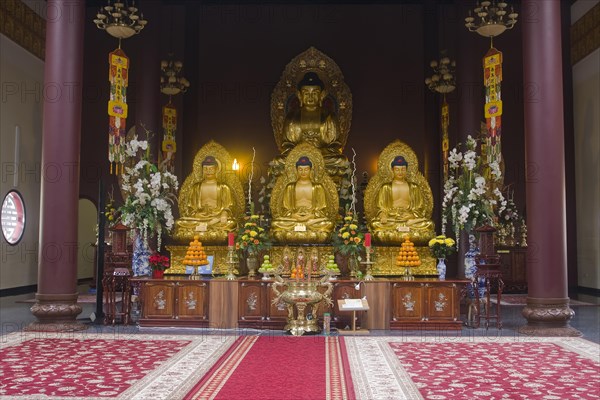 Buddha statues with an altar in Linh Thuu Pagoda