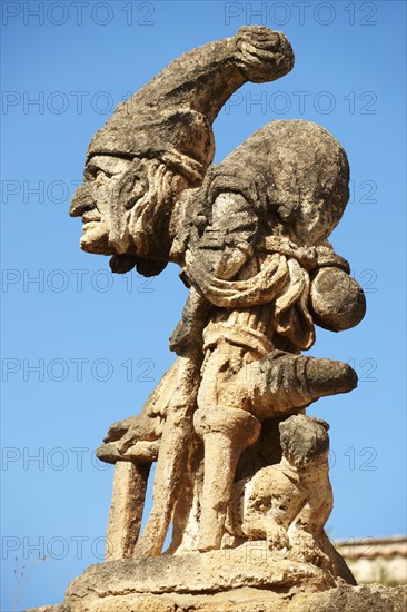 Baroque statue on the wall of Villa Palagonia