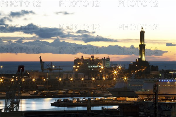 The Lighthouse of Genoa with cruise ship in the Porto Antico harbour