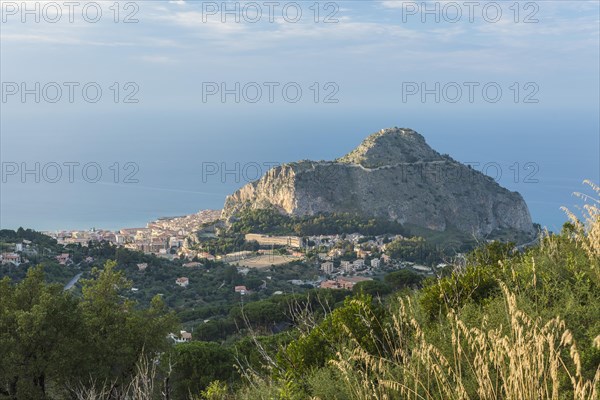 Limestone rock Rocca di Cefalu with the town of Cefalu
