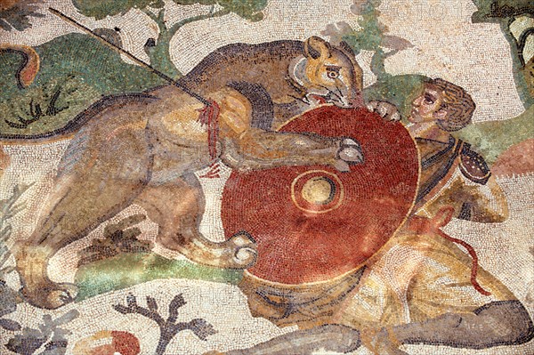 Ancient Roman mosaic of a hunter and a lion