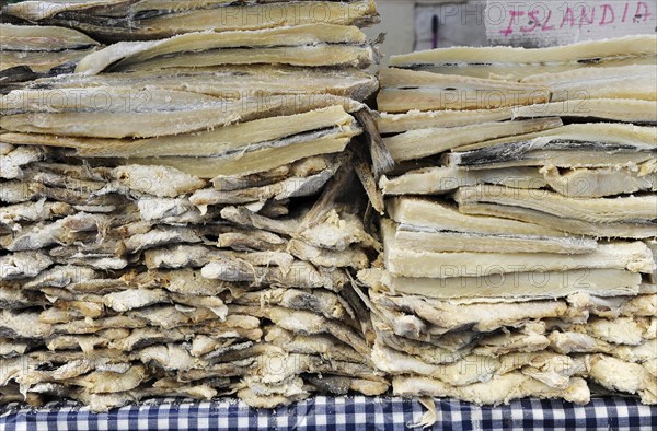 Icelandic salted dried cod stacked in market stall at the annual All Saints Market in Cocentaina