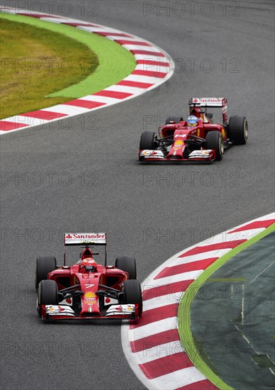 Kimi Raikkonen in the Ferrari F14 followed by Fernando Alonso in the Ferrari F14 T