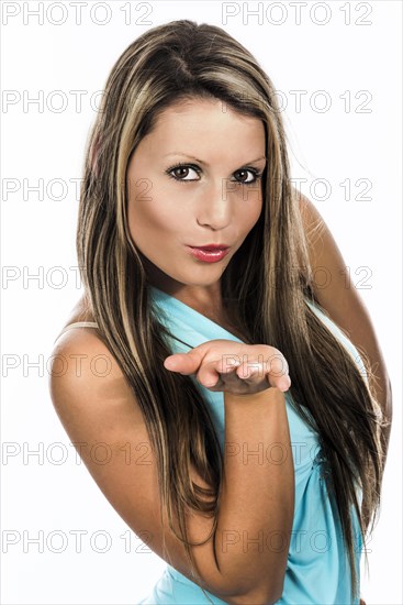Young woman blowing a kiss