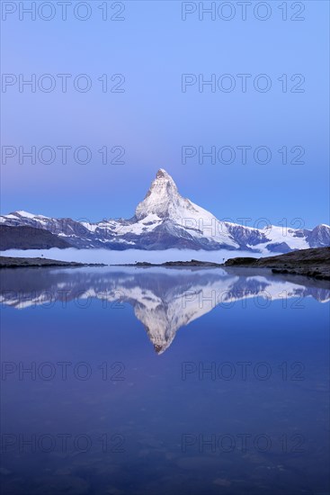 Mt Matterhorn reflected in Stellisee Lake at dusk