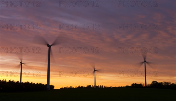Wind turbines at sunset