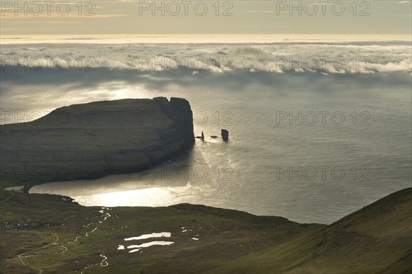 Kollur Mountain and the sea stacks of Risin and Kellingin in the evening light