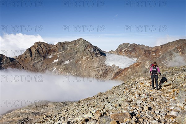 Mountain climber during the ascent of Fernerkoepfl Mountain in the Rieserferner Group in the Puster Valley