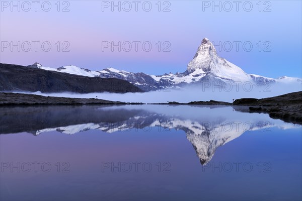 Matterhorn reflected in Lake Stellisee at dusk