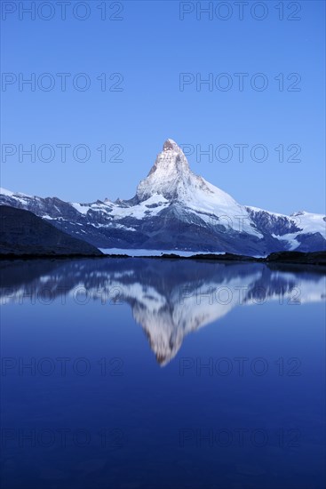 Mt Matterhorn reflected in Stellisee Lake at dusk