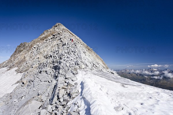 Mountain climbers during the ascent of Fernerkoepfl Mountain in the Rieserferner Group in the Puster Valley