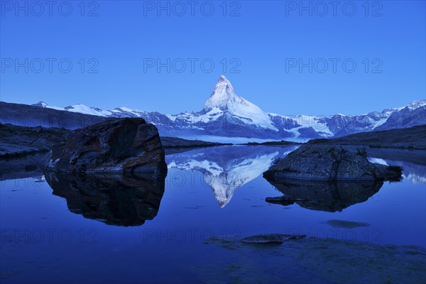 Mt Matterhorn reflected in Stellisee Lake at dusk