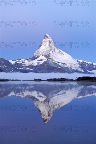 Matterhorn reflected in Lake Stellisee at dusk