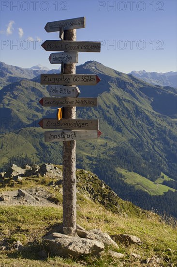 Signpost on Kellerjoch Mountain in front of the Tux Alps