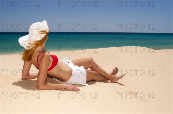 Woman wearing a hat and a bikini