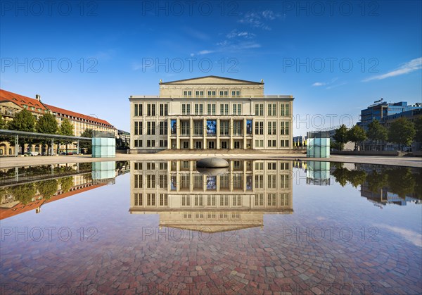 Opera Leipzig with reflection in the water of the Opernbrunnen