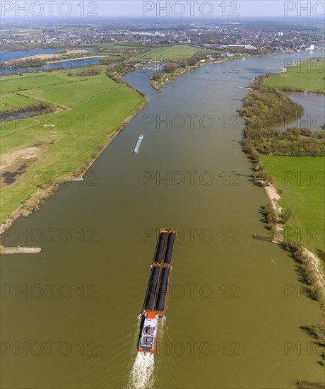 Push boat transporting coal on the Rhine River