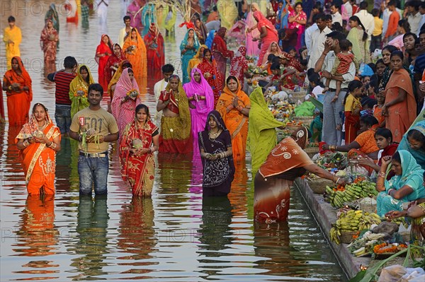 Hindus standing in water during the Hindu Chhath Festival