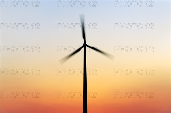 Wind turbine at sunset