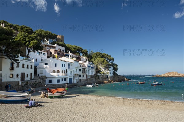 Houses and fishing boats by the sea