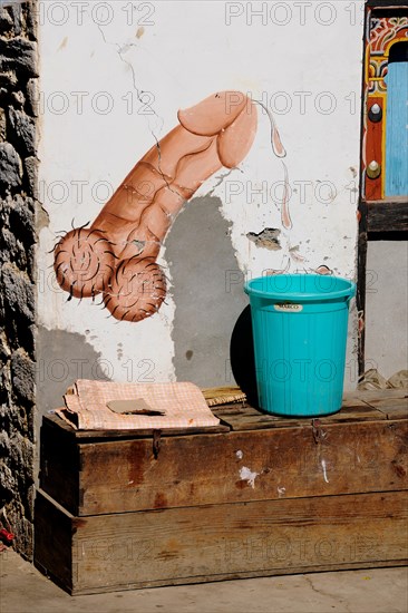 Phallic fertility symbol at the entrance of a house