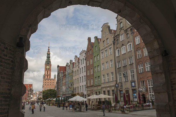 View through Green Gate or Brama Zielona towards the houses on Long Market or Dlugi Targ and the clock tower of Main Town Hall