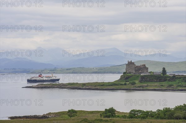 Ferry passing Duart Castle on the west coast