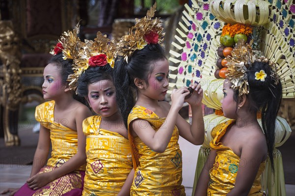 Girls at a Barong dance taking pictures