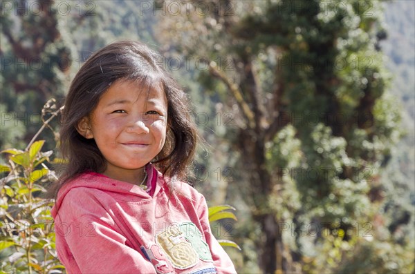 Portrait of a local girl with pink sweater