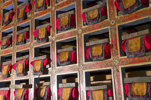 Colorful shelf with tibetean prayerbooks
