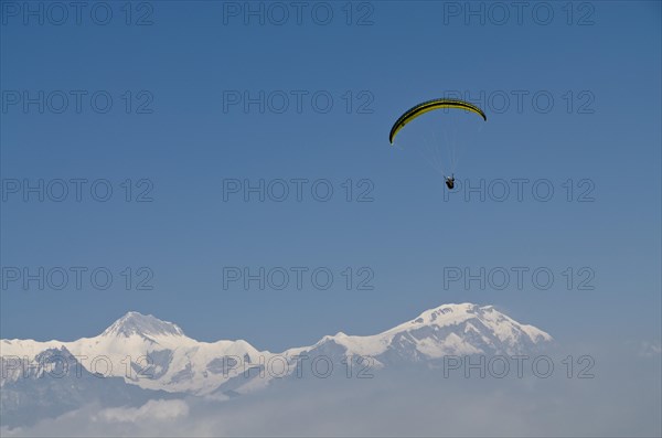 Paraglider sailing through the air