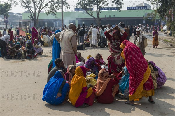 Crowds of people waiting for delayed trains all over the railway station