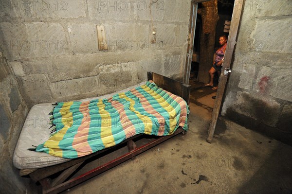 Basic room with a bed in a cheap brothel on the outskirts of the city