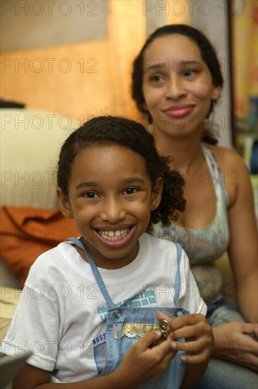 Girl and mother in a slum or favela