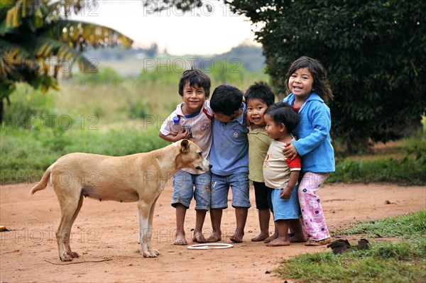 Group of happy children with a dog