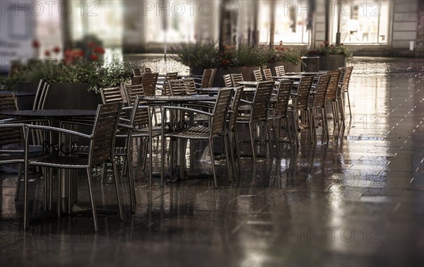 Wet restaurant chairs and restaurant tables
