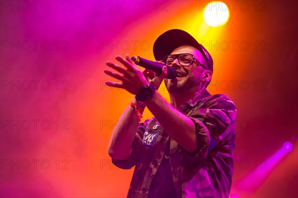Swiss rapper Greis performing live at the Heitere Open Air music festival