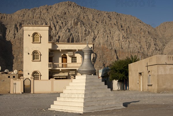 Scuplture of a traditional Arabian coffee pot as a symbol of Arab tradition and hospitality