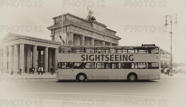 Sightseeing bus for a city tour in front of the Brandenburg Gate