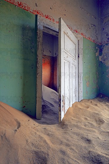 Building taken over by sand from the desert