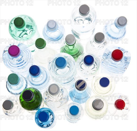 Different varieties of mineral water in bottles made of glass and plastic or PET